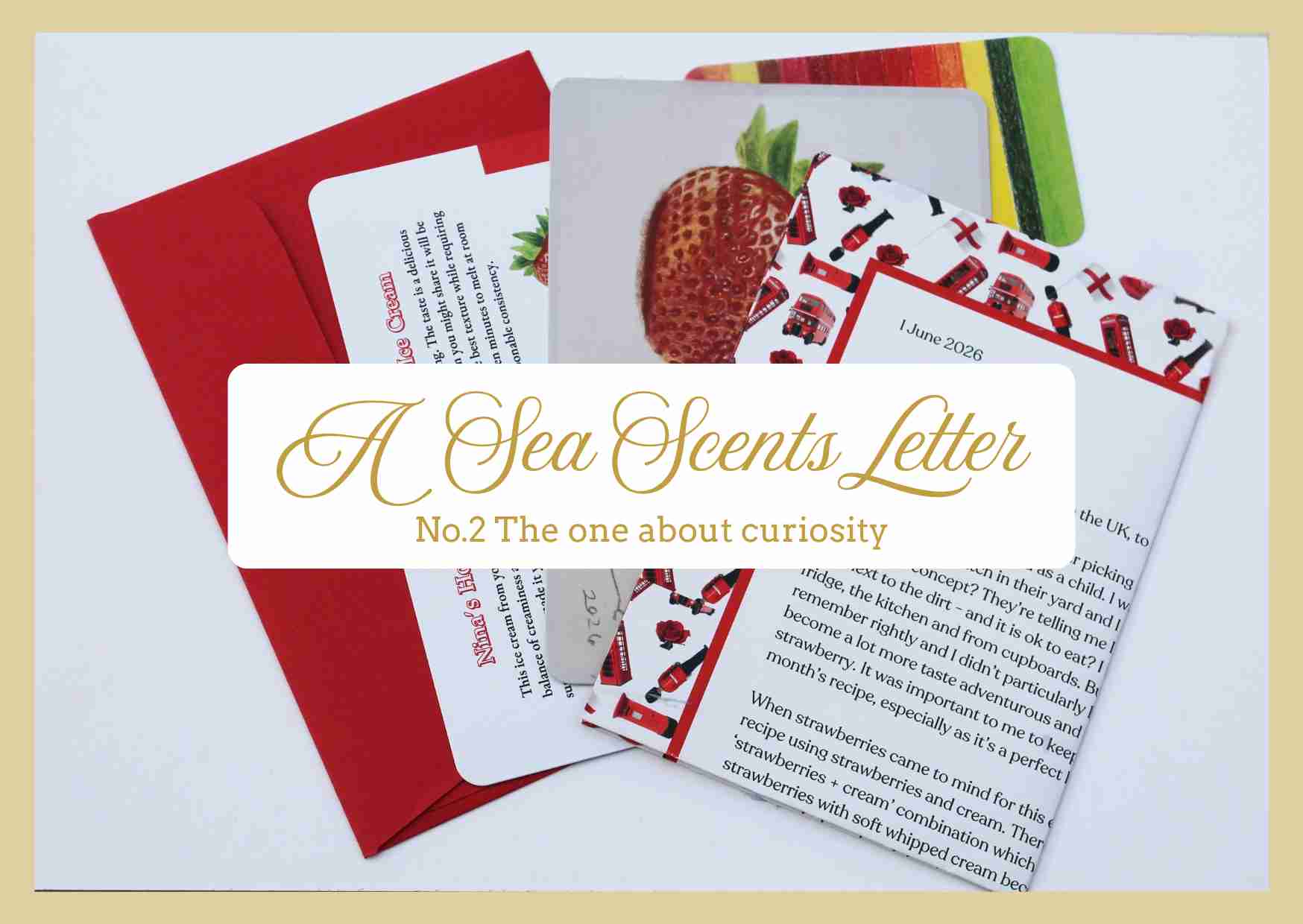 A Sea Scents Letter No.2 featuring a red envelope, a strawberry-themed card, and a letter printed with text, overlaid with a white text box reading 'A Sea Scents Letter No.2 The one about curiosity'